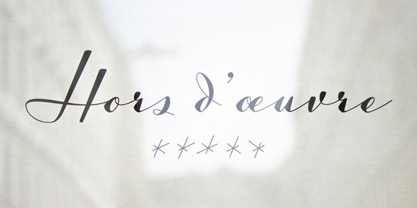 Card displaying Luxus Brut Sparkling typeface in various styles